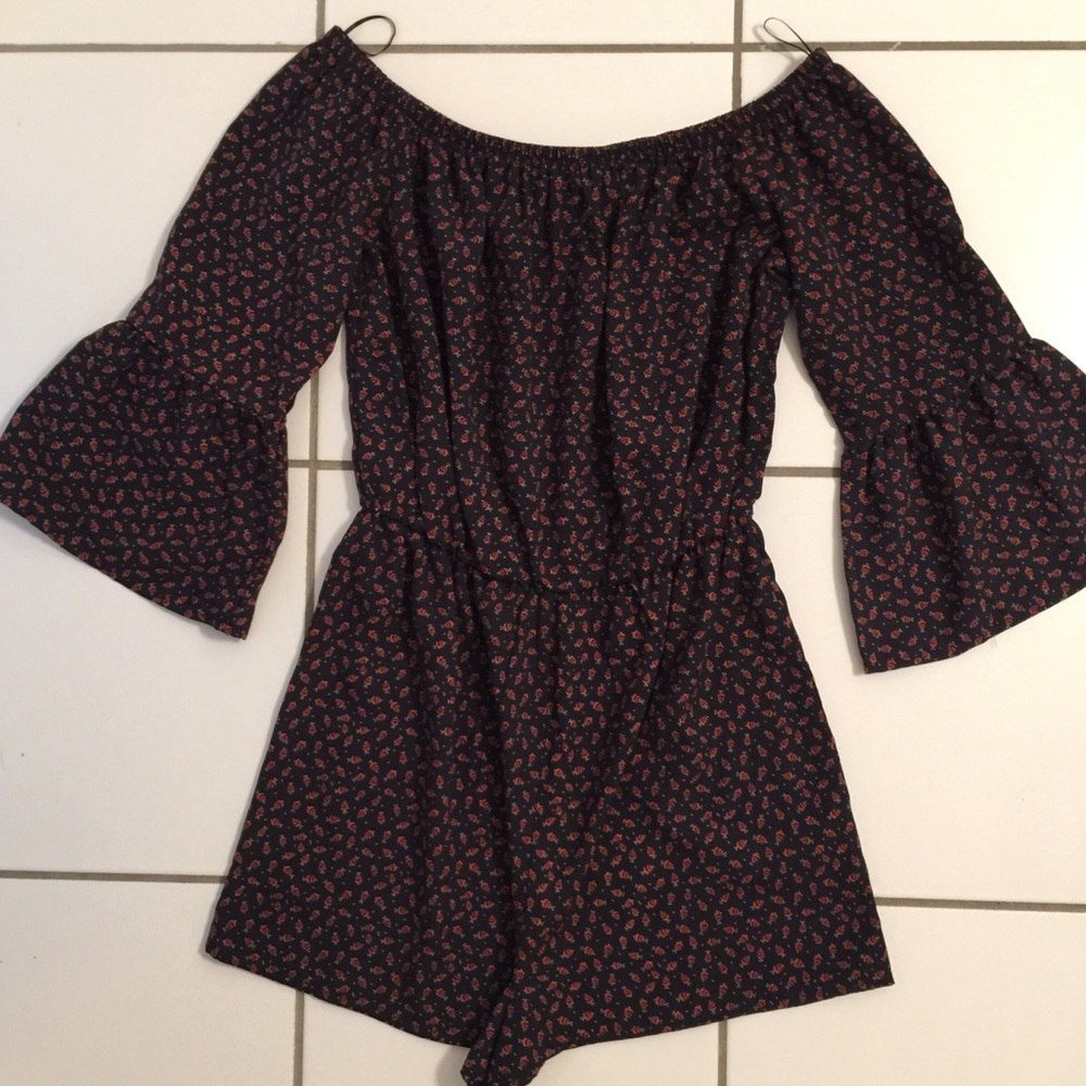 black off the shoulder romper with flared sleeves